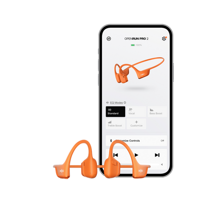 Orange bone-conduction sport earbuds shown in front of a smartphone screen displaying the OpenRun Pro 2 app interface on a clean white background.